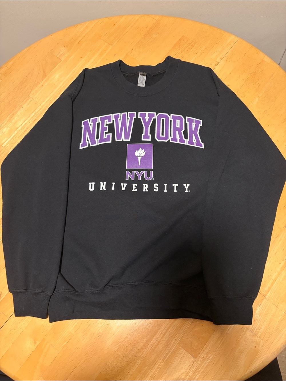 Gildan Black Crewneck Sweatshirt with Purple NYU Logo